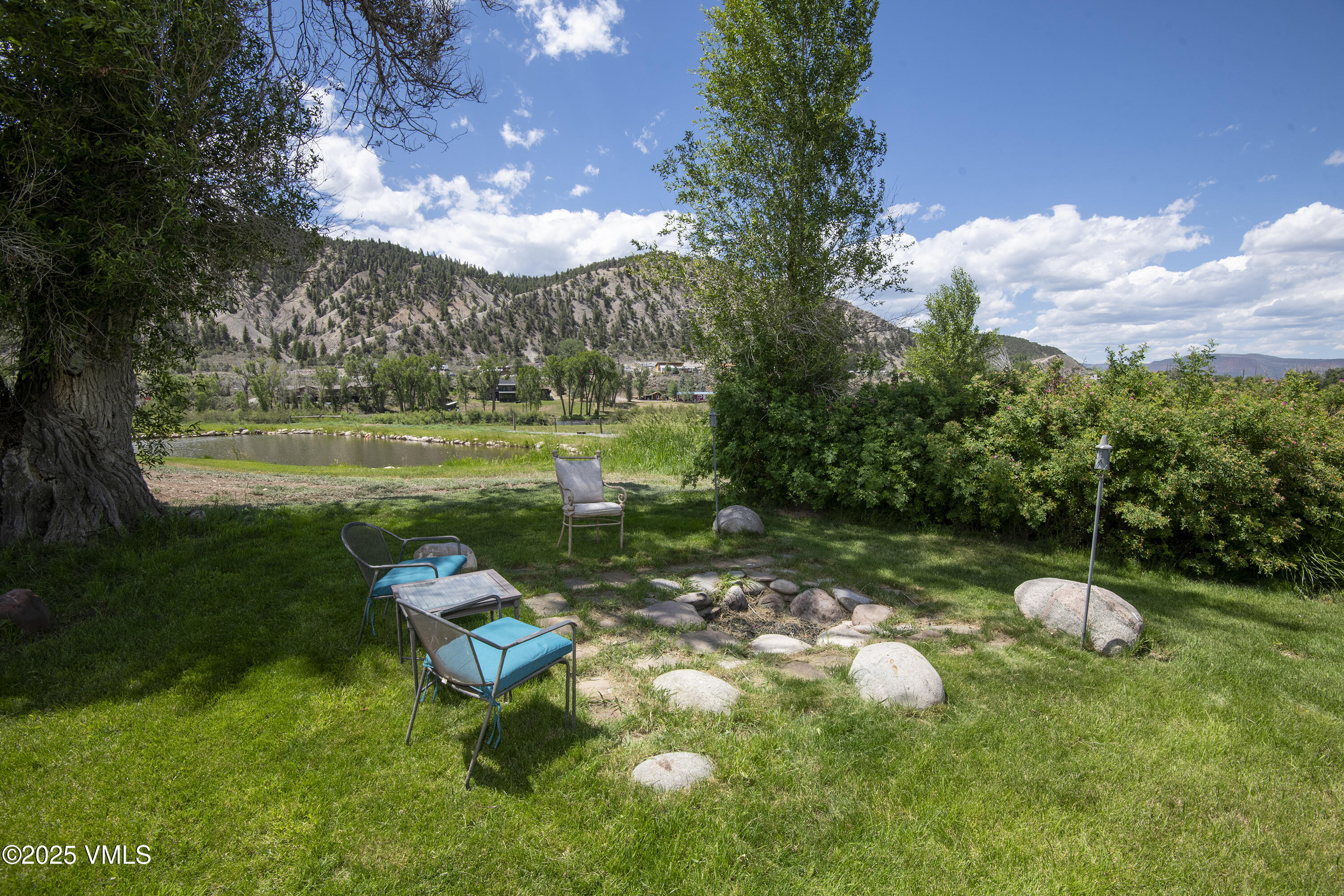 14555 Highway 6 Eagle, CO 81631 - Photo 46 of 61 a view of a lake with a yard