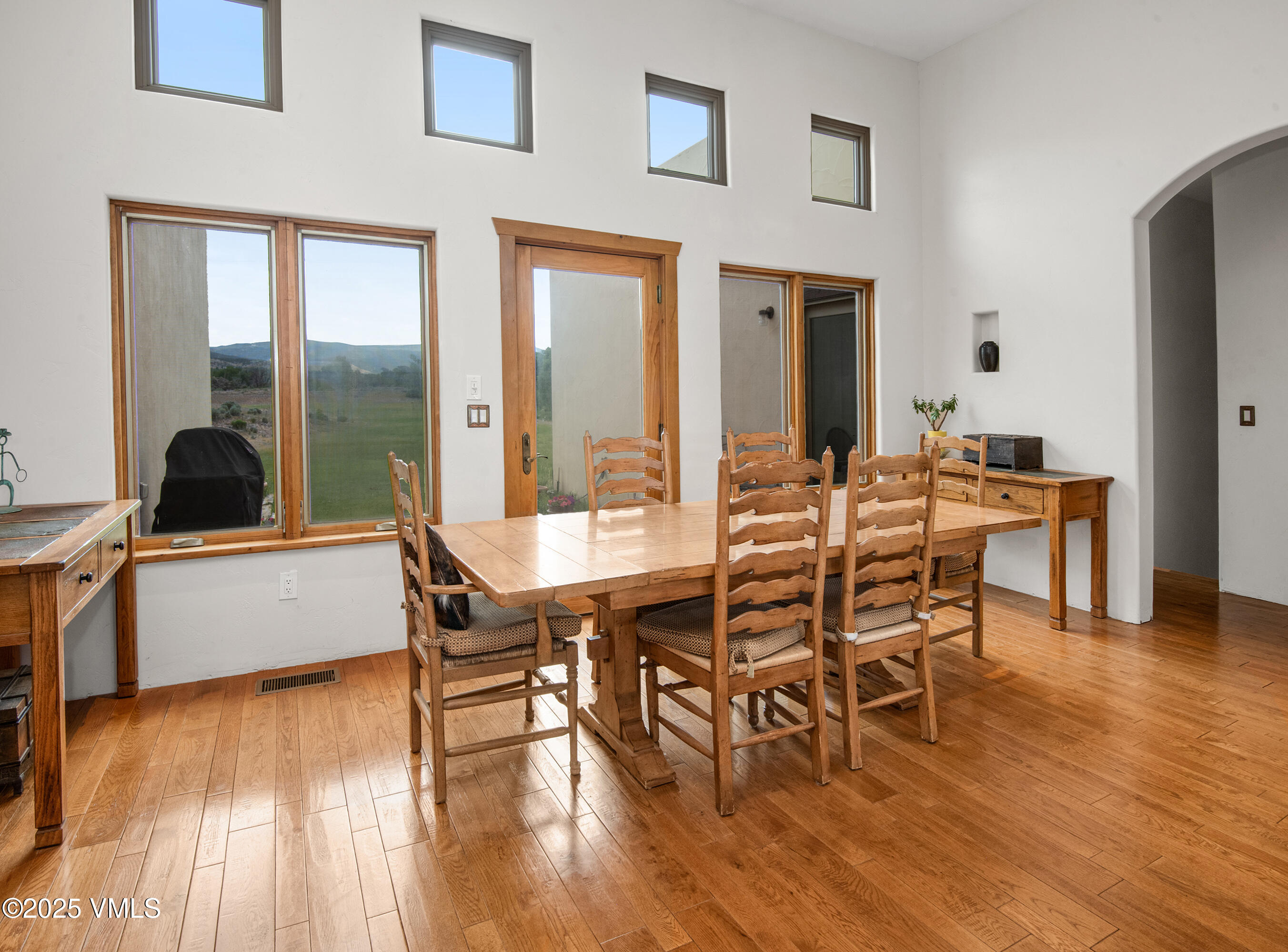 14555 Highway 6 Eagle, CO 81631 - Photo 7 of 61 a dining room with furniture a chandelier and wooden floor