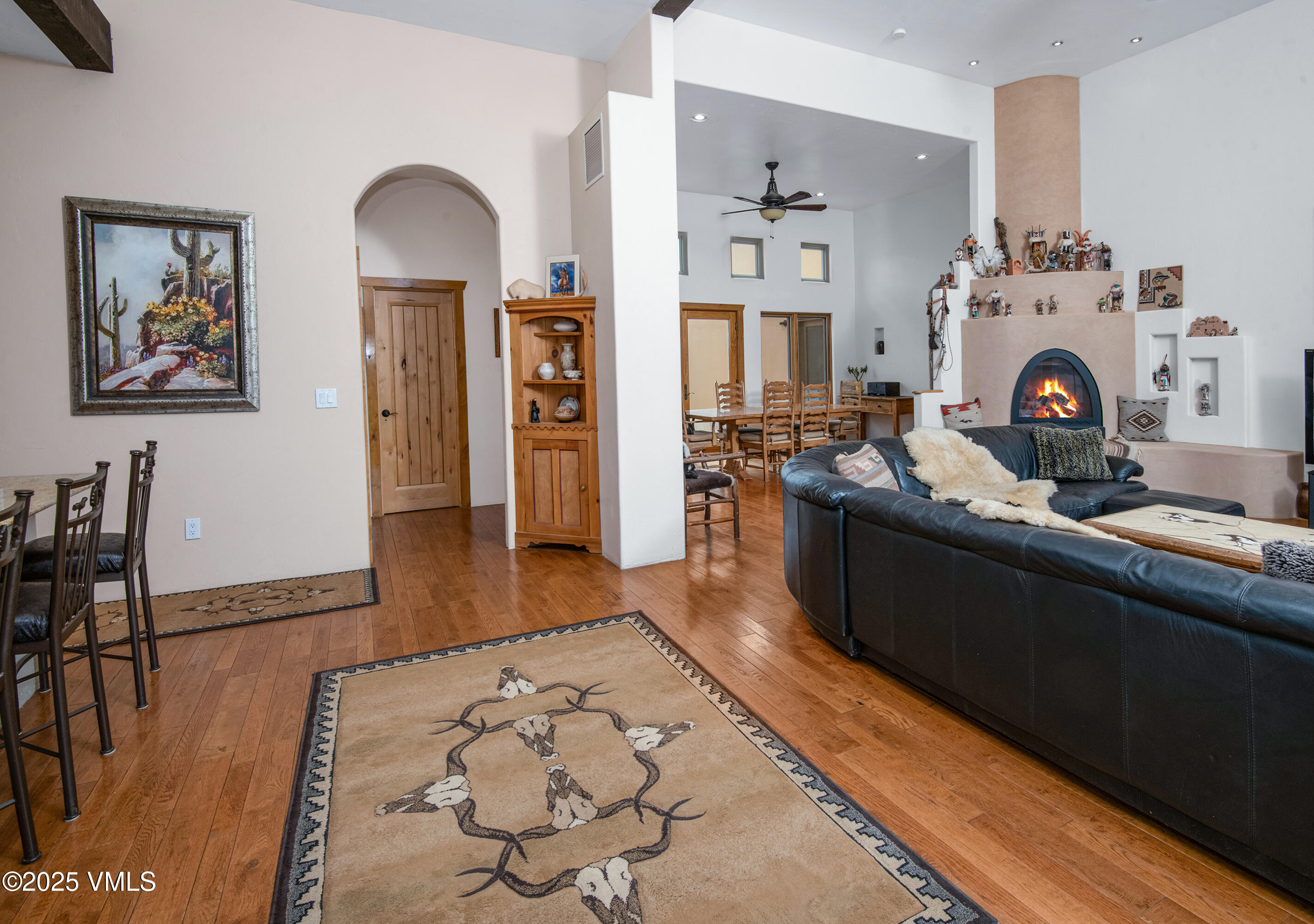 14555 Highway 6 Eagle, CO 81631 - Photo 8 of 61 a living room with furniture a rug a fireplace and wooden floor