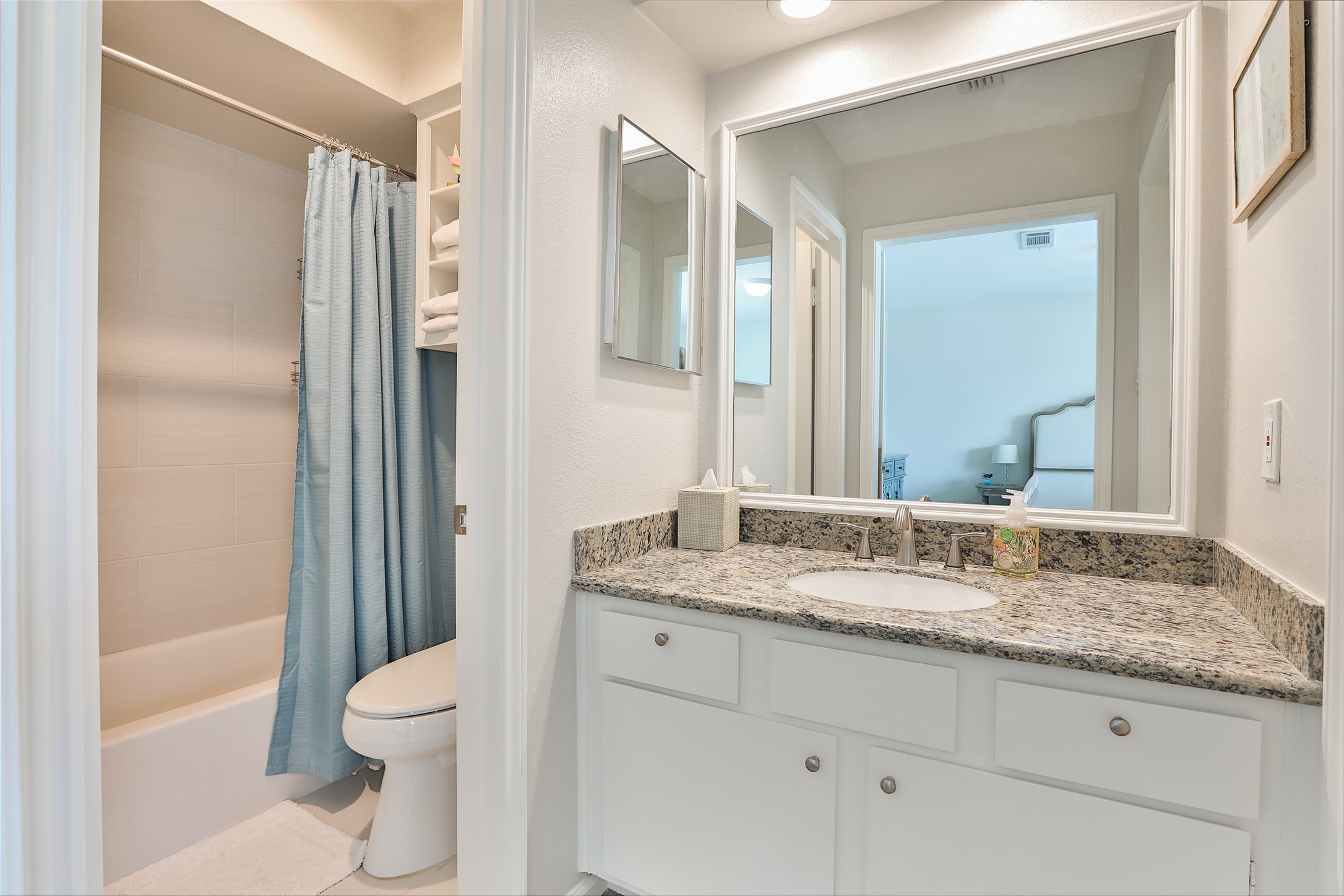 979 Memorial Village Drive, Unit 48 Houston, TX 77024 - Photo 15 of 18 a bathroom with a granite countertop sink toilet and shower