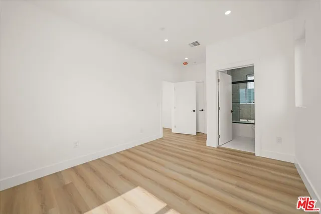 a bathroom with a toilet a sink and a mirror
