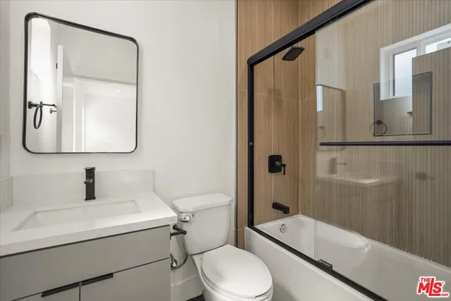 a bathroom with a tub and a shower