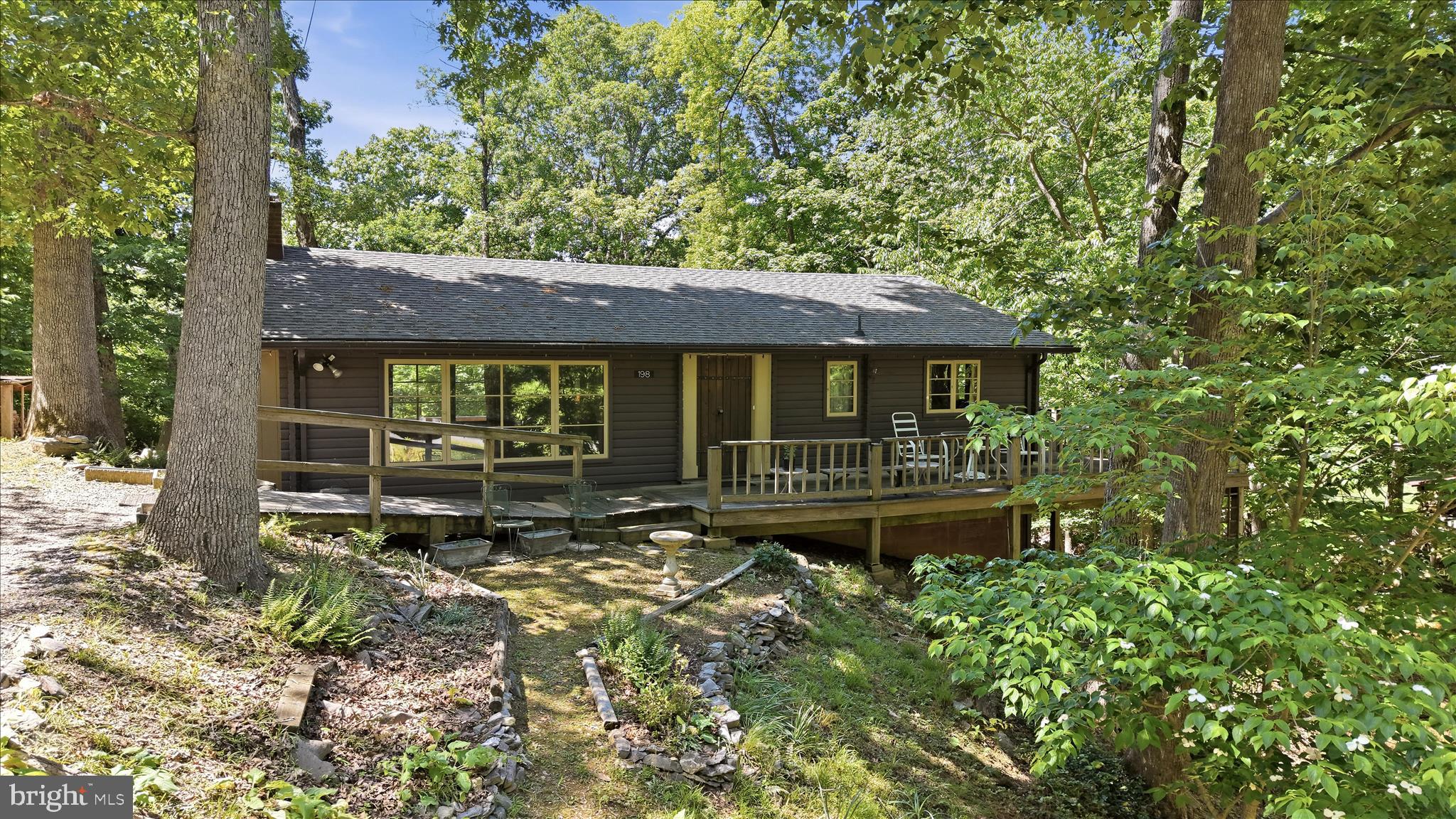 198 Spruce Road Front Royal, VA 22630 - Photo 1 of 59 a house with trees in the background