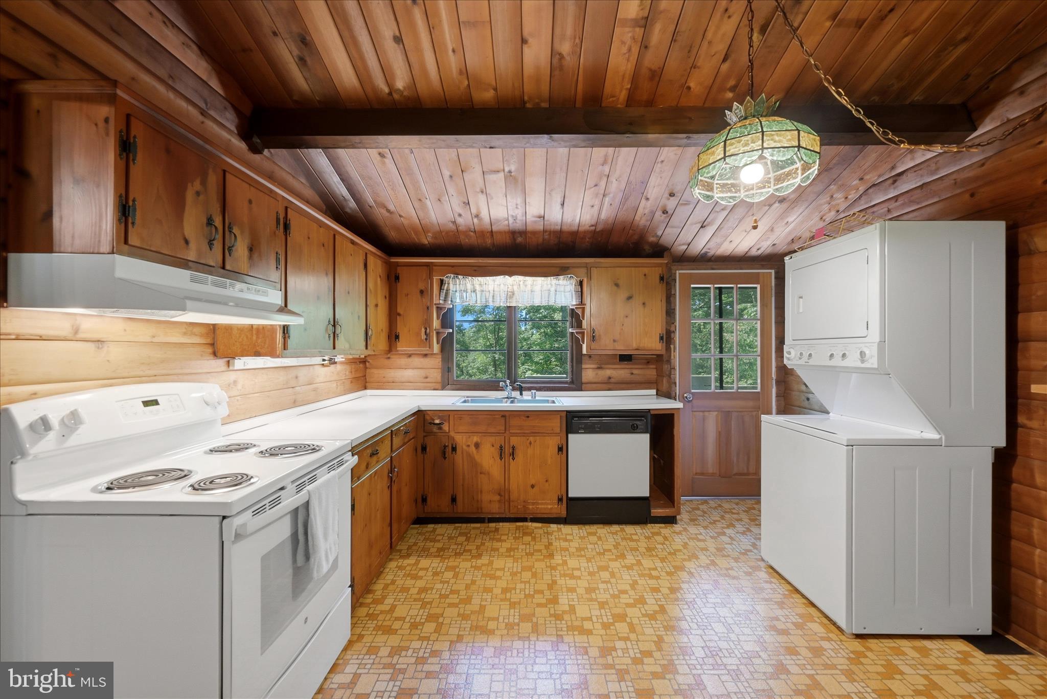 198 Spruce Road Front Royal, VA 22630 - Photo 28 of 59 a kitchen with stainless steel appliances granite countertop a sink a stove oven a counter space and a window