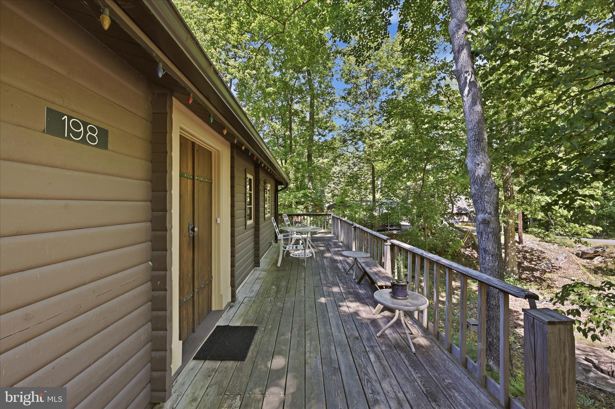 198 Spruce Road Front Royal, VA 22630 - Photo 6 of 59 a balcony with wooden floor and outdoor seating