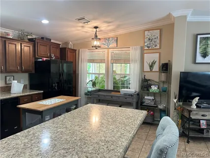 a large bedroom with a large bed and a dresser