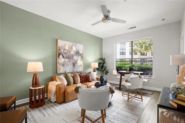 a living room with furniture and a large window