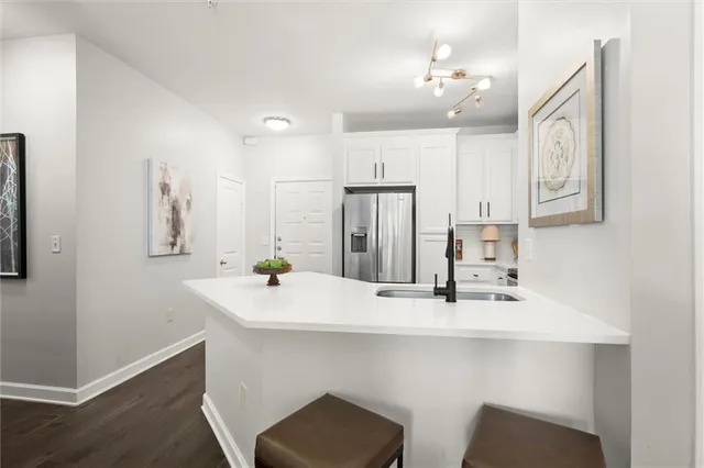 a kitchen with stainless steel appliances a sink and cabinets