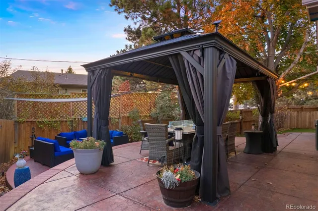 a view of a two chairs in the patio