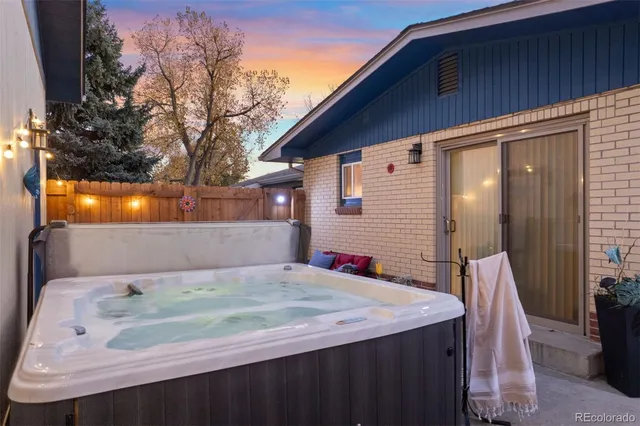 a balcony with a table and chairs
