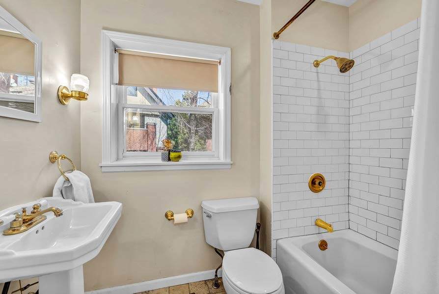 4249 North Hazel Street Chicago, IL 60613 - Photo 12 of 14 a bathroom with a sink and a mirror