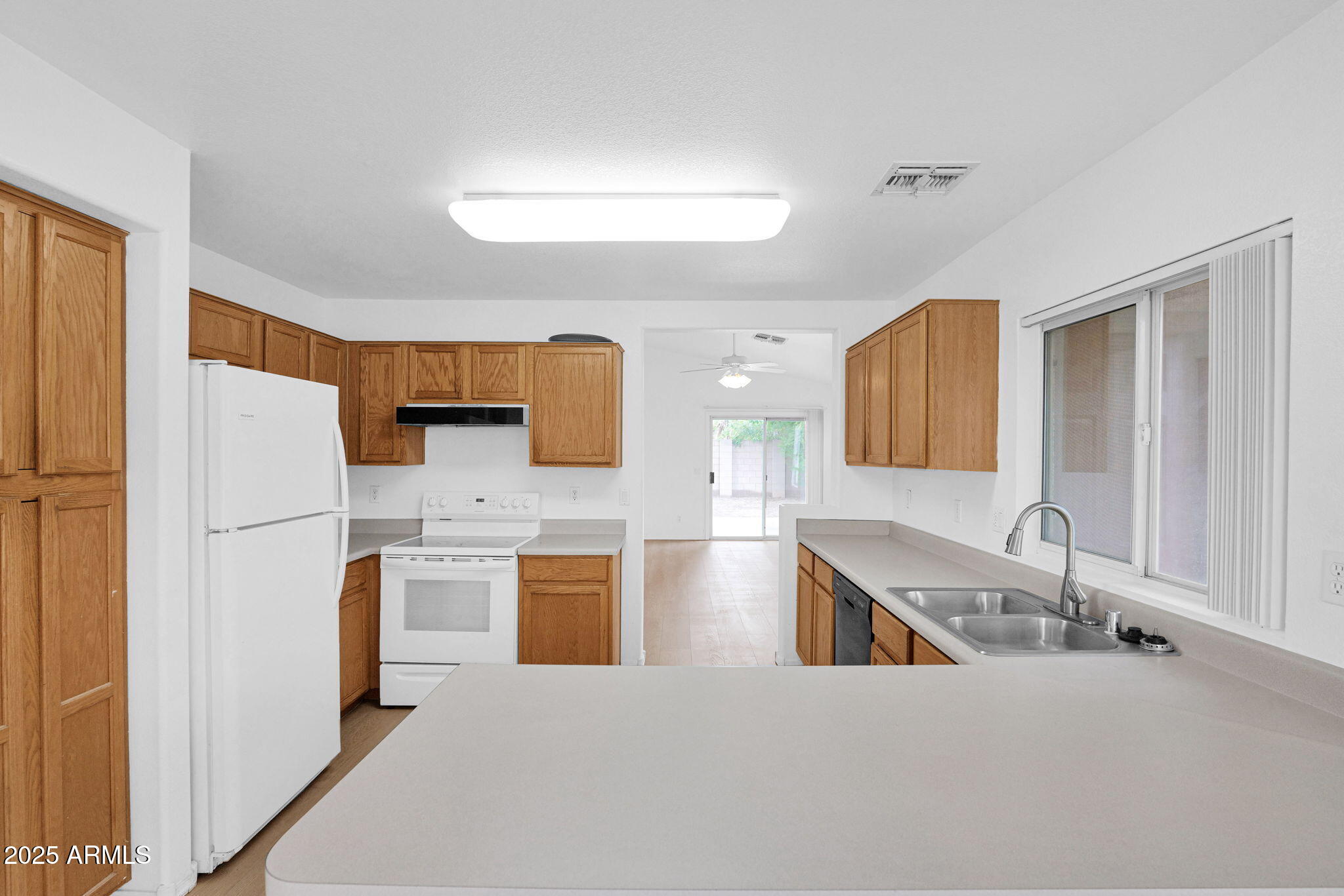 882 East Monterey Street Chandler, AZ 85225 - Photo 12 of 33 a kitchen with stainless steel appliances a refrigerator and a sink