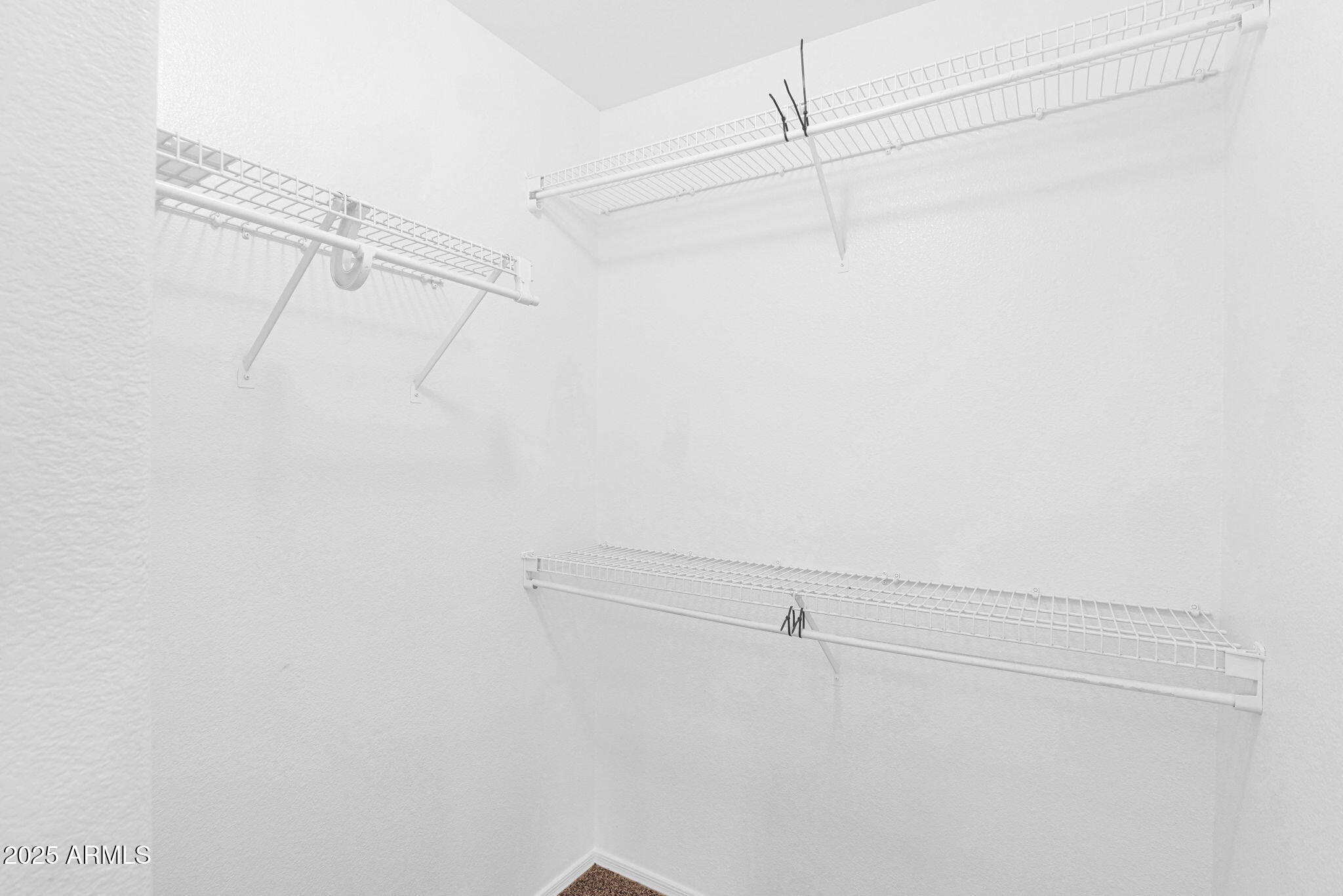 882 East Monterey Street Chandler, AZ 85225 - Photo 24 of 33 a view of a room with racks on the wall