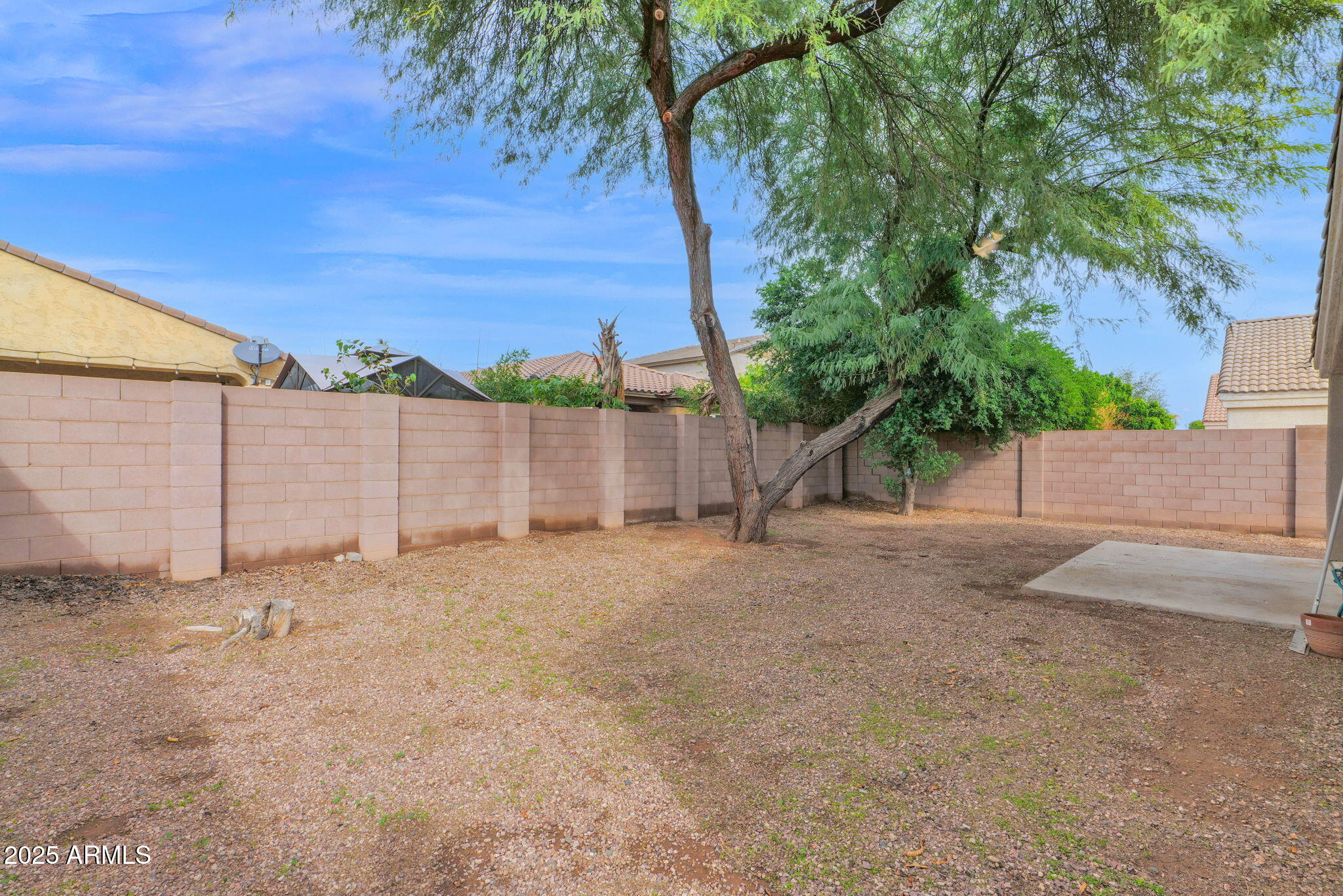 882 East Monterey Street Chandler, AZ 85225 - Photo 31 of 33 a backyard of a house with a yard and garage