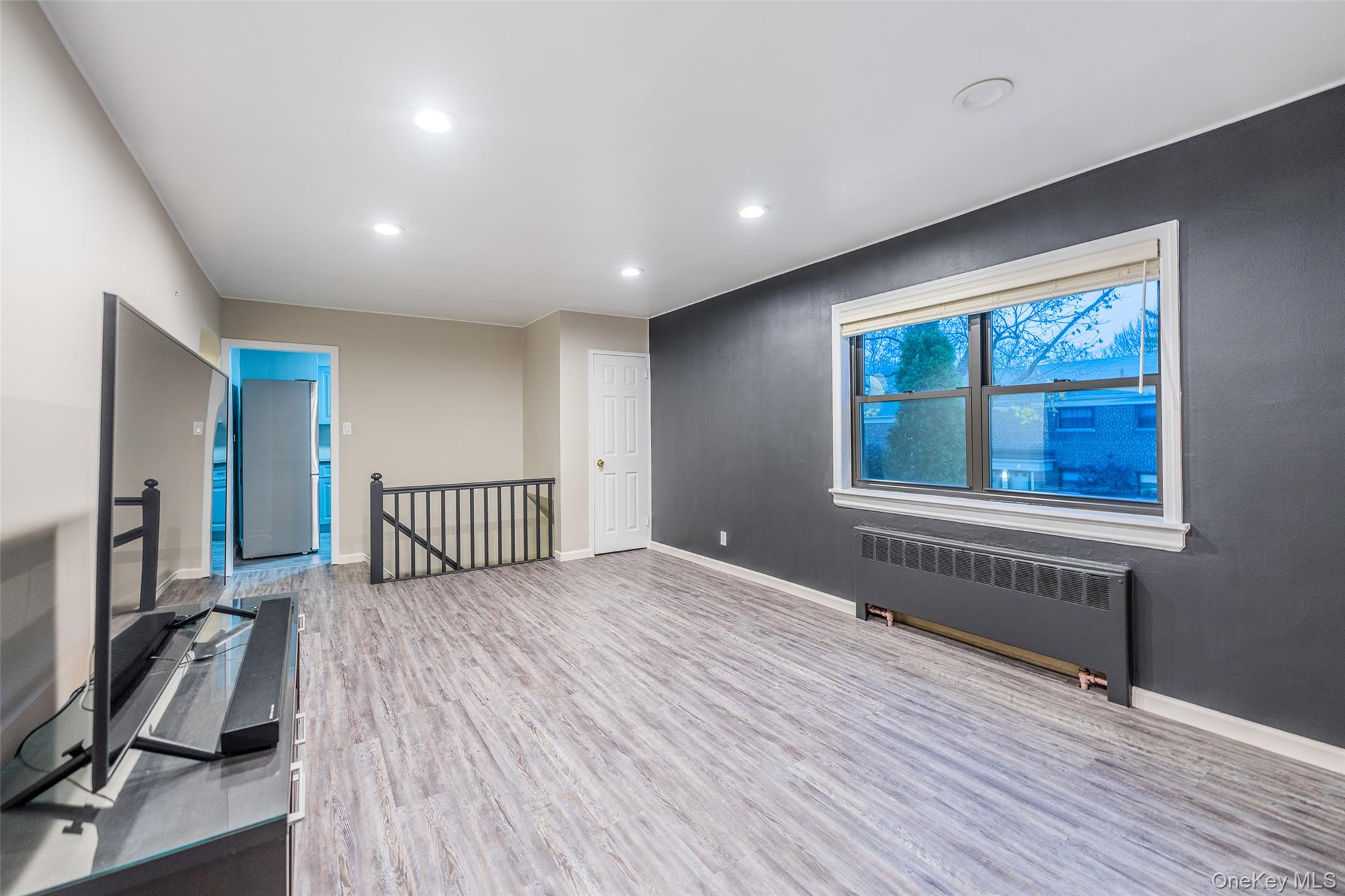 220-16 73rd Avenue, Unit 13A2 Queens, NY 11364 - Photo 13 of 18 a view of a livingroom with a staircase