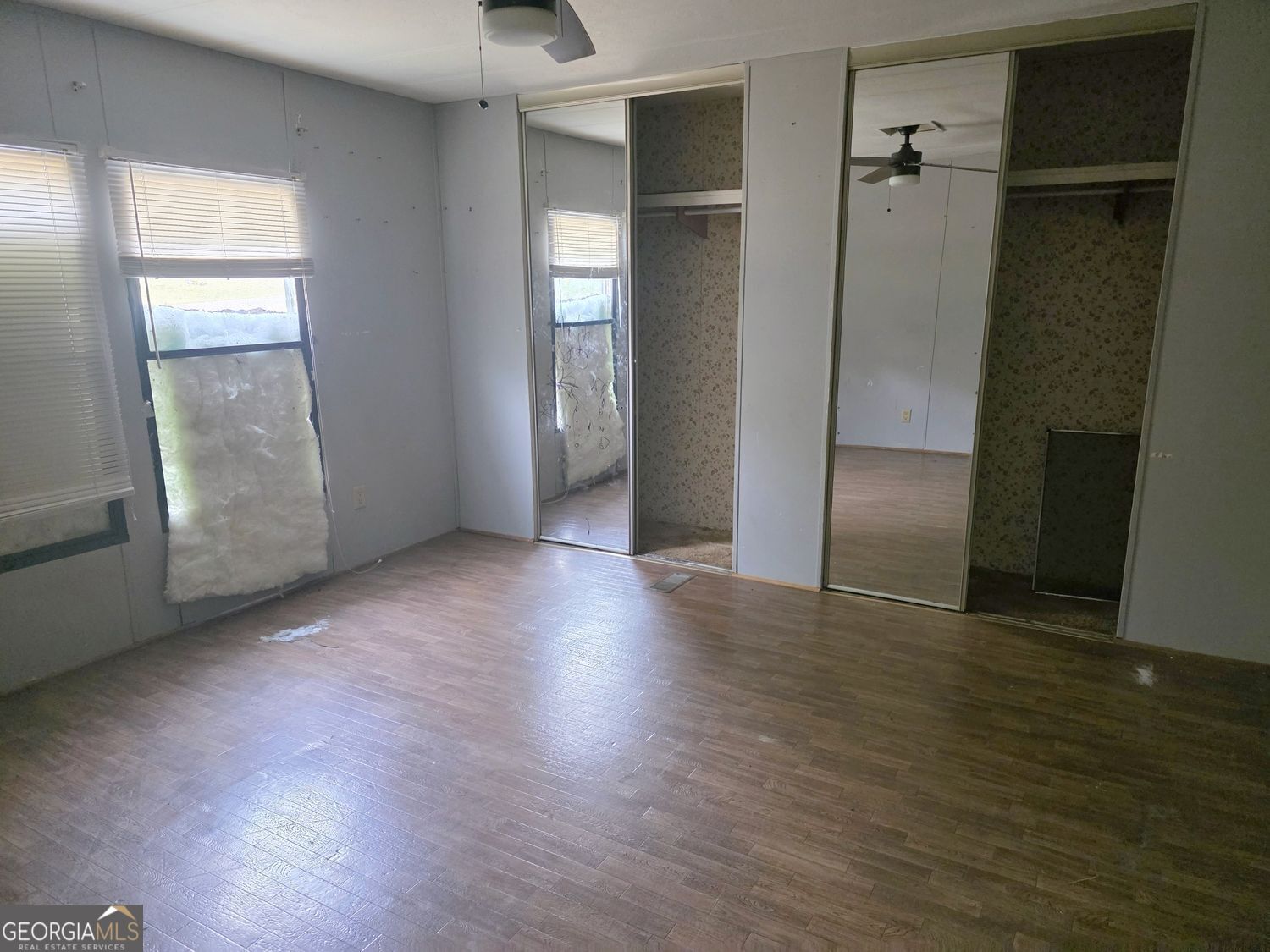 15 Shady Lane Jackson, GA 30233 - Photo 13 of 30 an empty room with wooden floor and windows