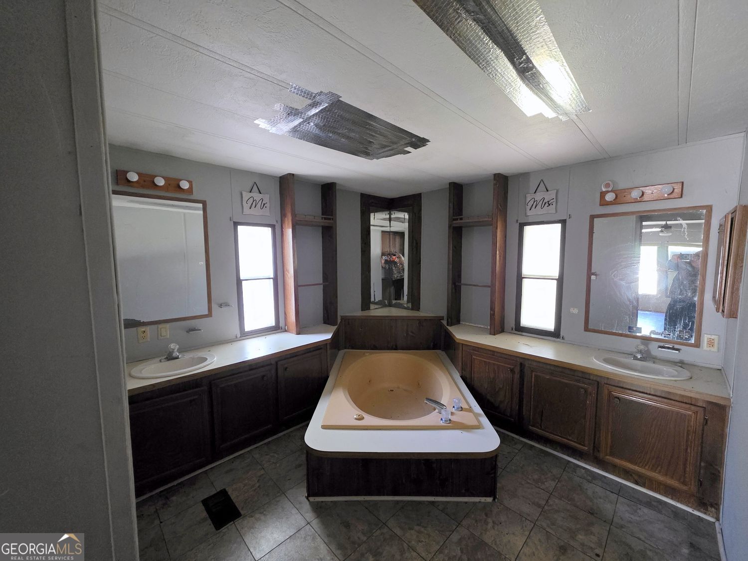 15 Shady Lane Jackson, GA 30233 - Photo 14 of 30 a large kitchen with kitchen island a large counter space a sink a window and stainless steel appliances