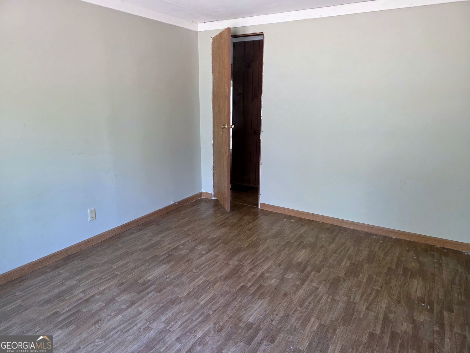 15 Shady Lane Jackson, GA 30233 - Photo 18 of 30 a view of an empty room with wooden floor and closet