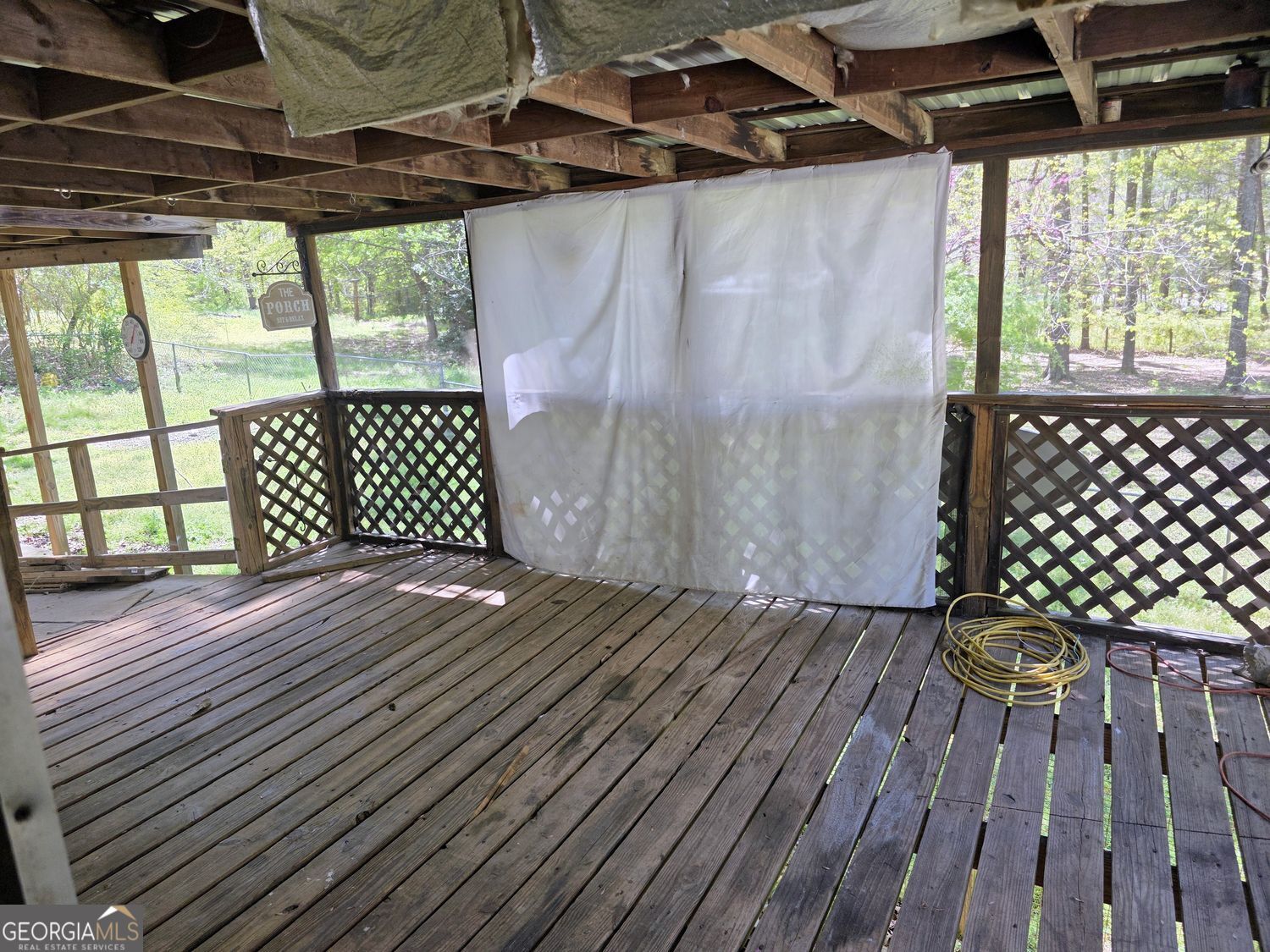 15 Shady Lane Jackson, GA 30233 - Photo 25 of 30 a view of a black gate with wooden floor