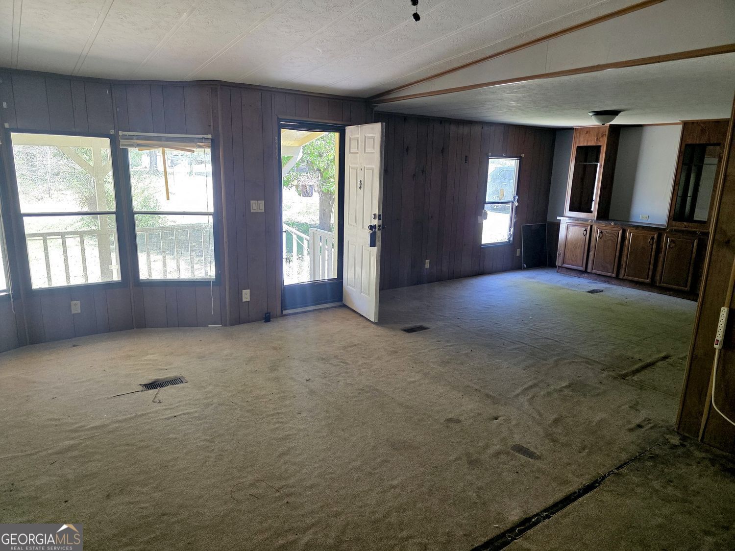 15 Shady Lane Jackson, GA 30233 - Photo 5 of 30 a view of an empty room with a window and fireplace