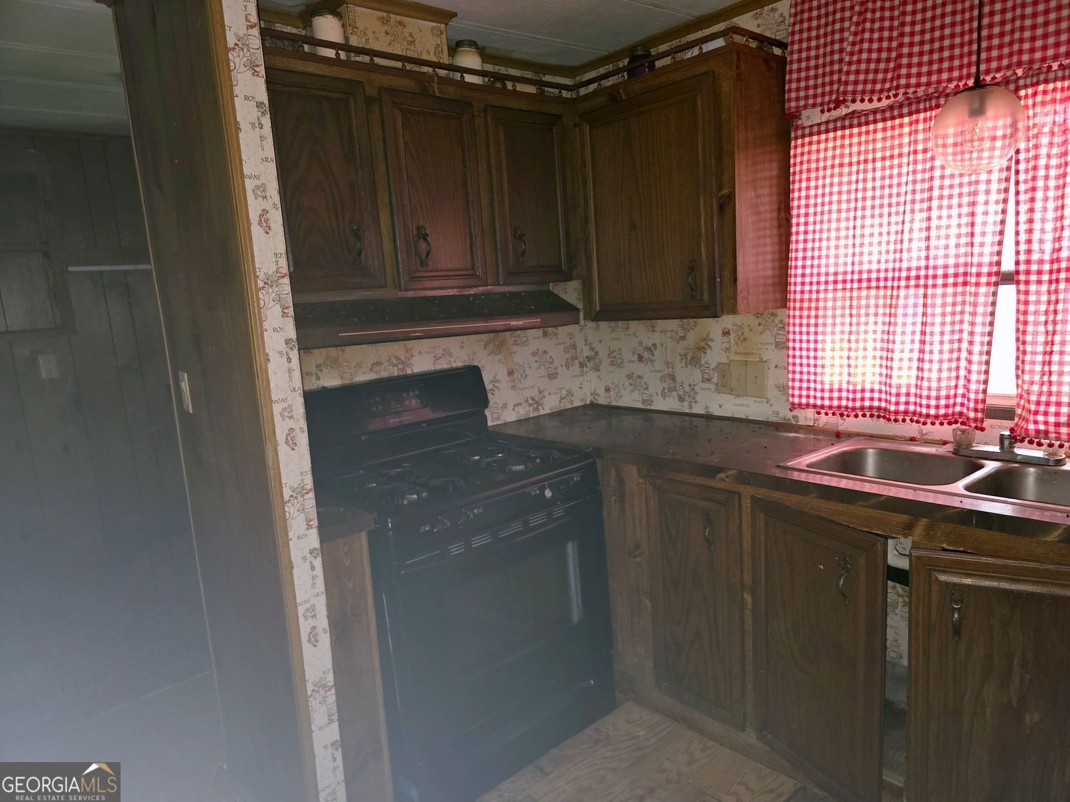 15 Shady Lane Jackson, GA 30233 - Photo 10 of 30 a kitchen with a sink and cabinets