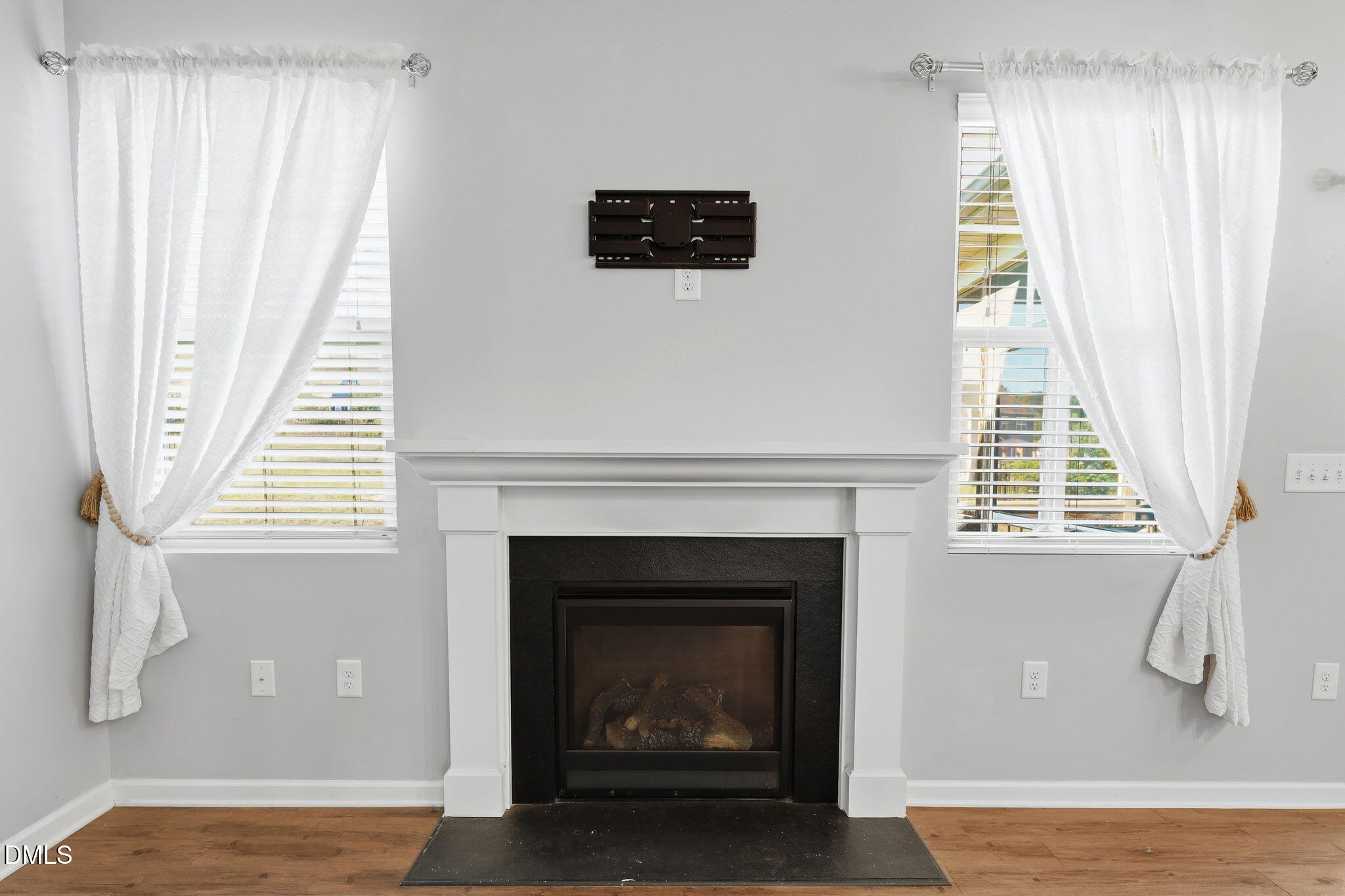 1808 Austin Rdg Parkway Wake Forest, NC 27587 - Photo 18 of 57 a living room with a fireplace and a window