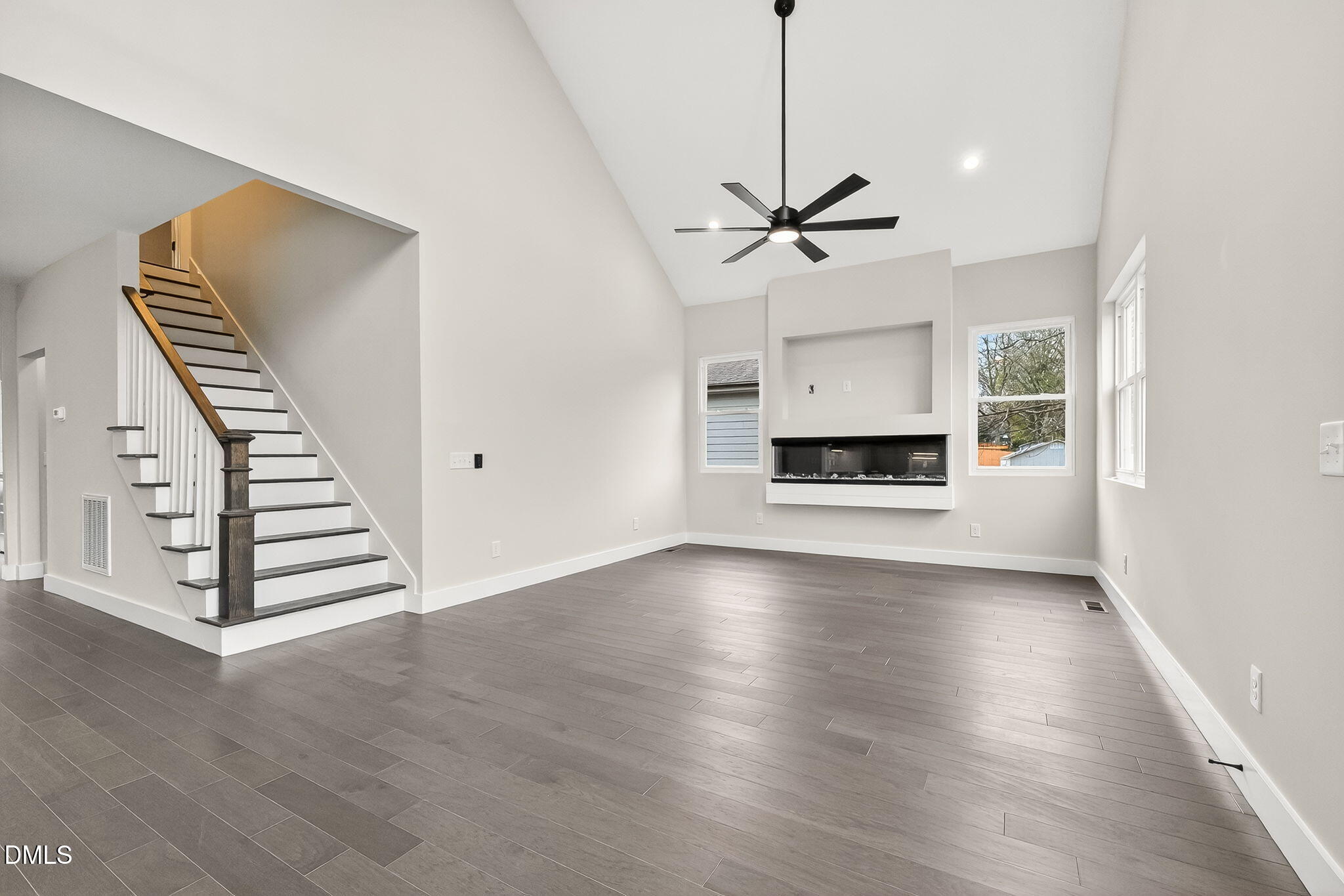 104 South Driver Street Durham, NC 27703 - Photo 12 of 53 a view of a livingroom with a fireplace wooden floor and staircase