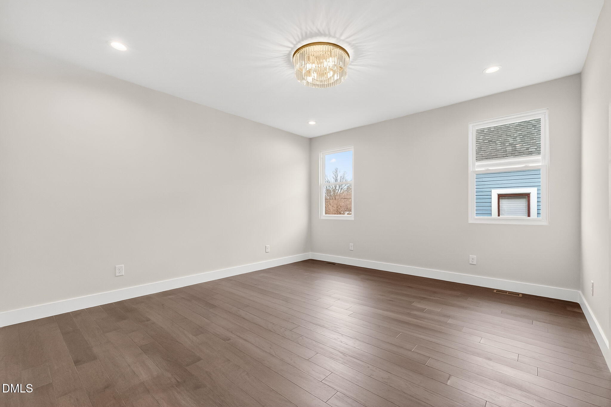 104 South Driver Street Durham, NC 27703 - Photo 26 of 53 an empty room with wooden floor and windows