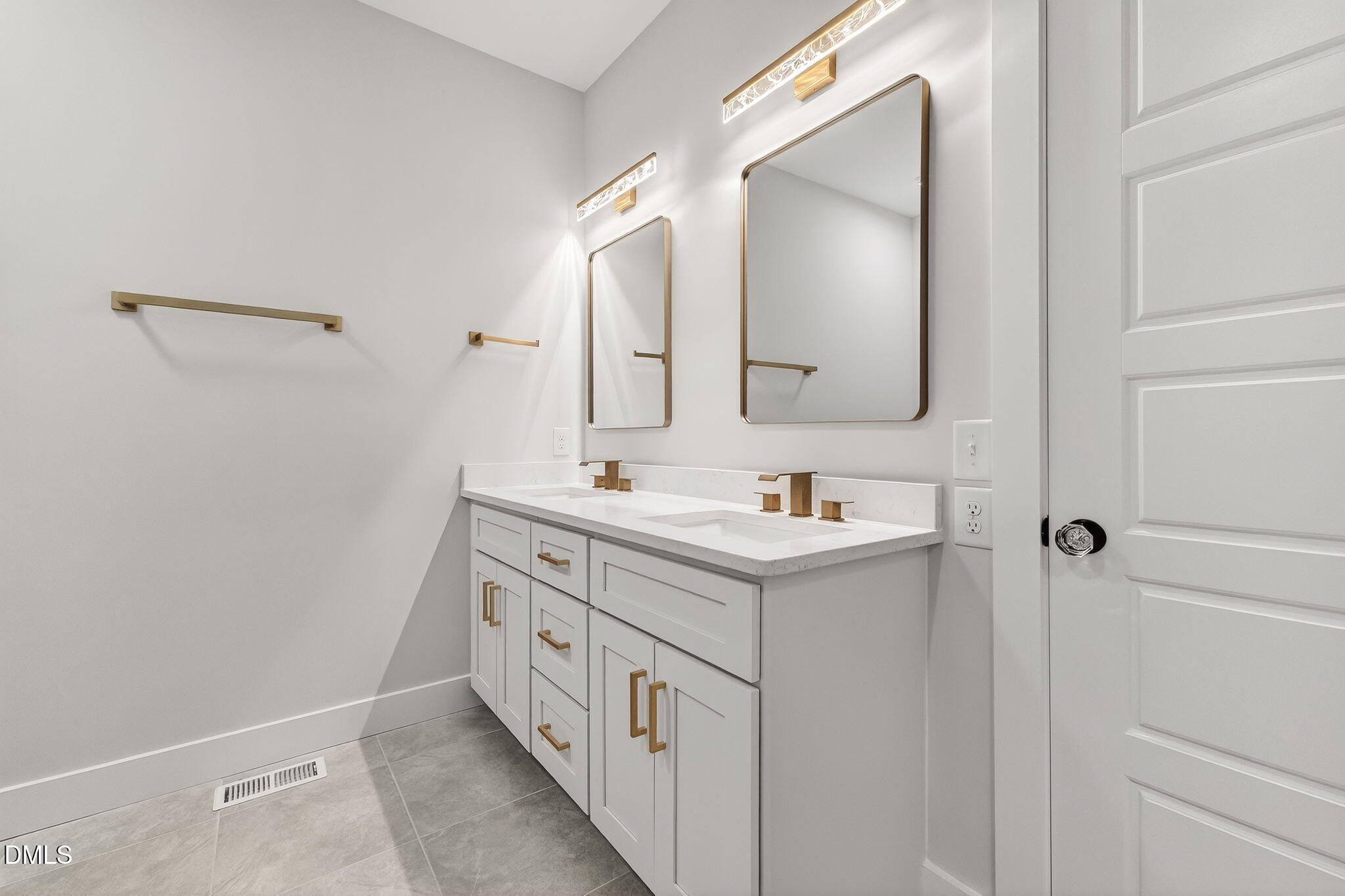 104 South Driver Street Durham, NC 27703 - Photo 29 of 53 a bathroom with a double vanity sink and mirror