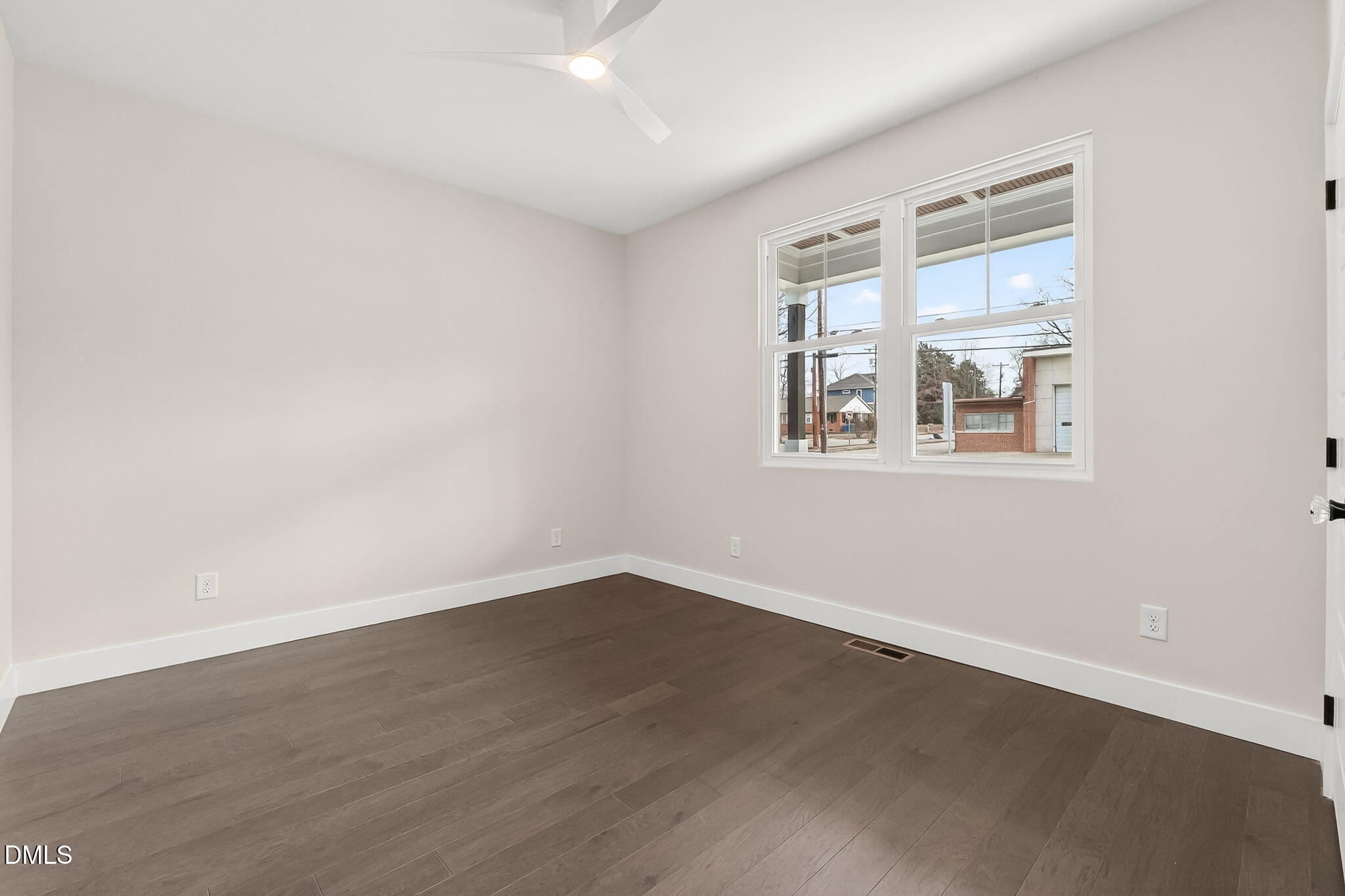 104 South Driver Street Durham, NC 27703 - Photo 34 of 53 an empty room with wooden floor and windows