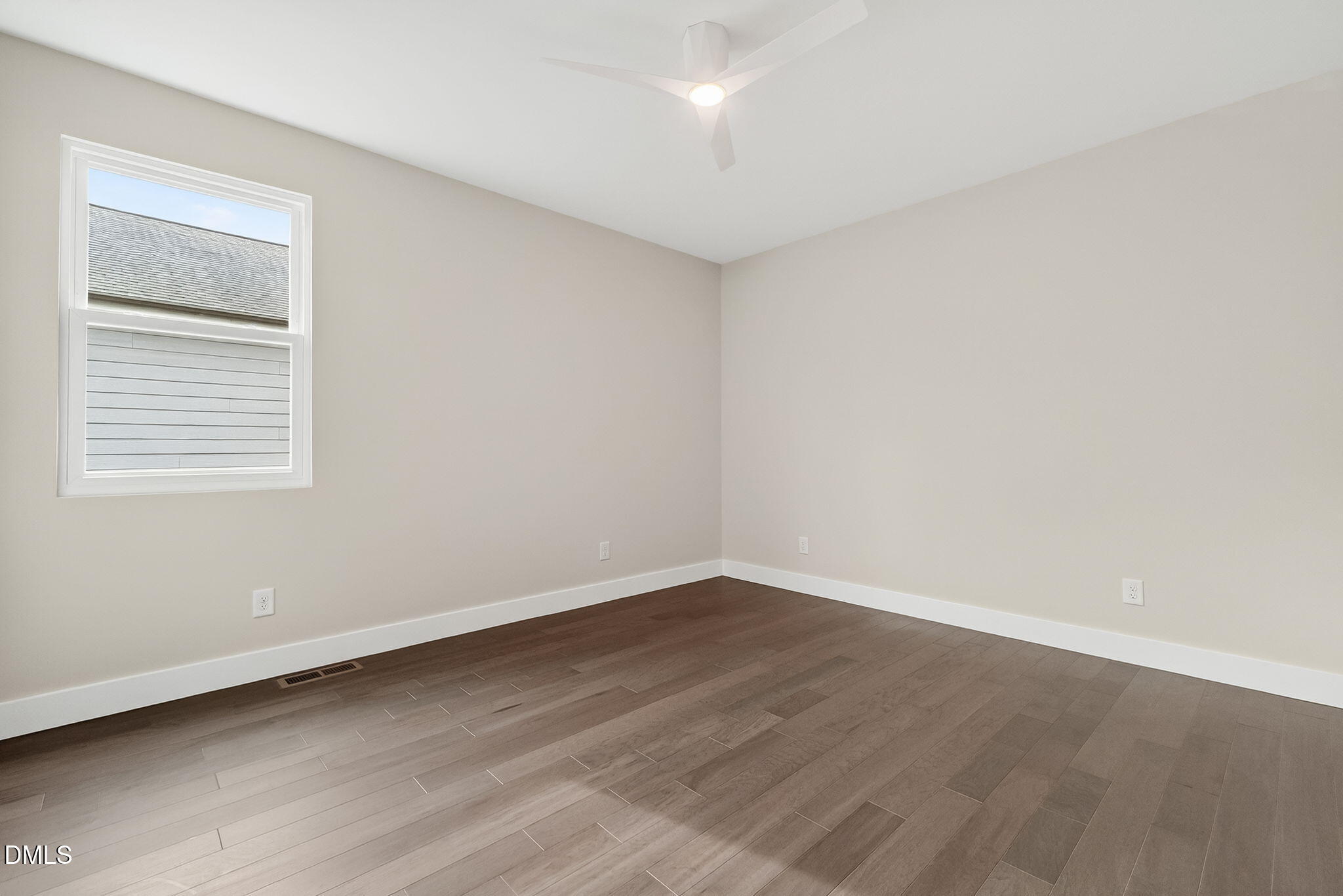 104 South Driver Street Durham, NC 27703 - Photo 39 of 53 an empty room with wooden floor and windows