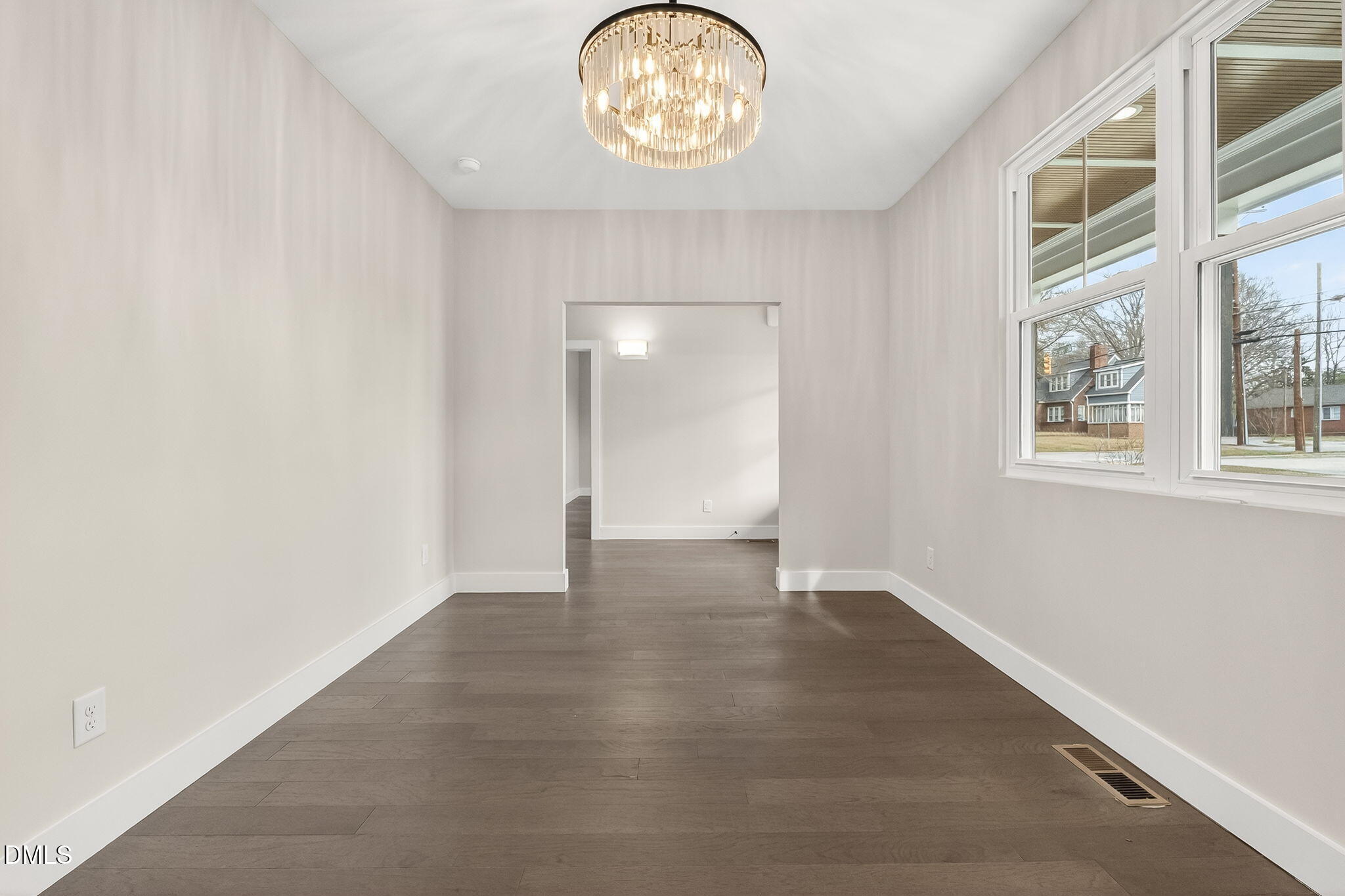 104 South Driver Street Durham, NC 27703 - Photo 8 of 53 an empty room with wooden floor and a window