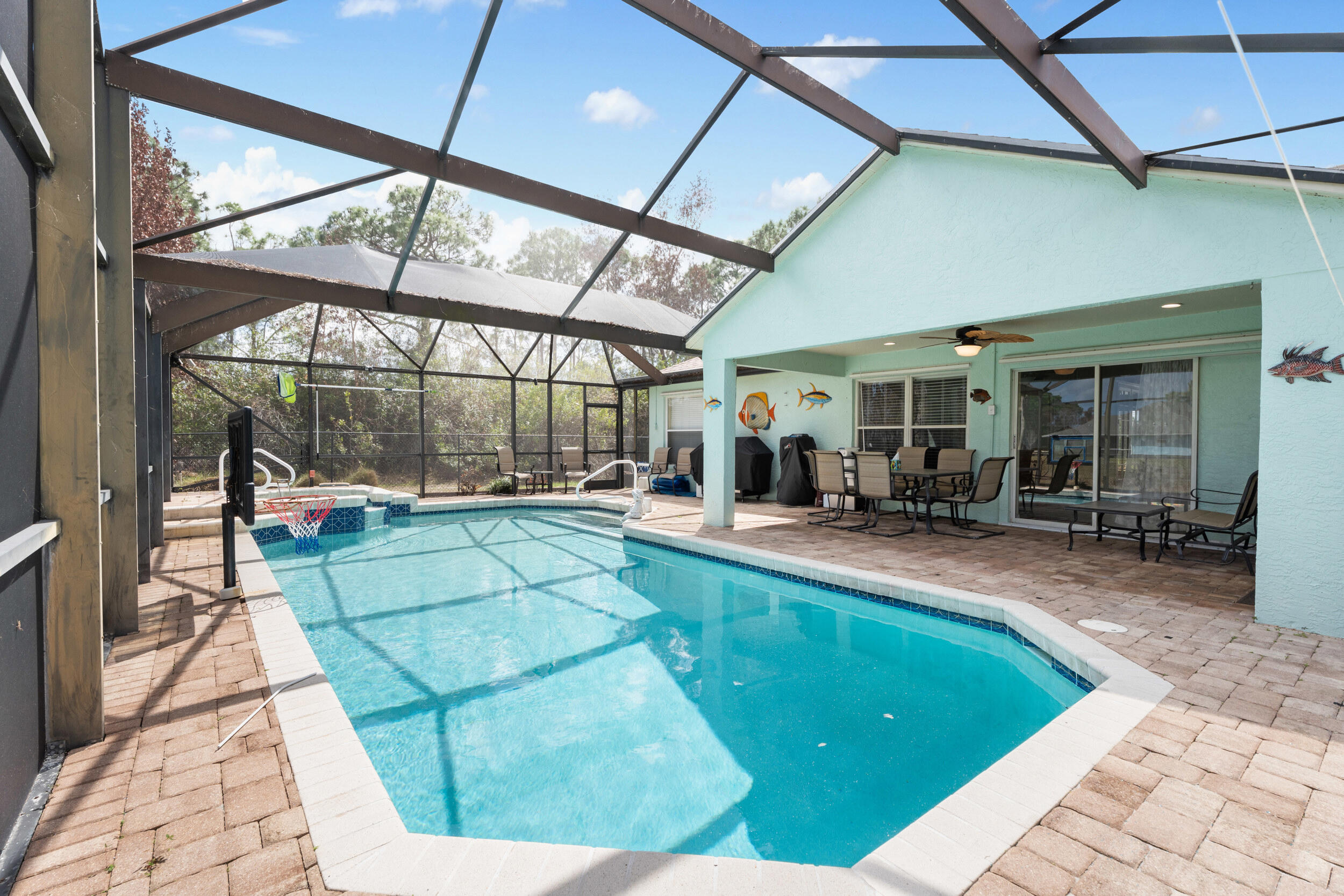 5593 Northwest Wesley Road Port St. Lucie, FL 34986 - Photo 2 of 33 Screened lanai and pool