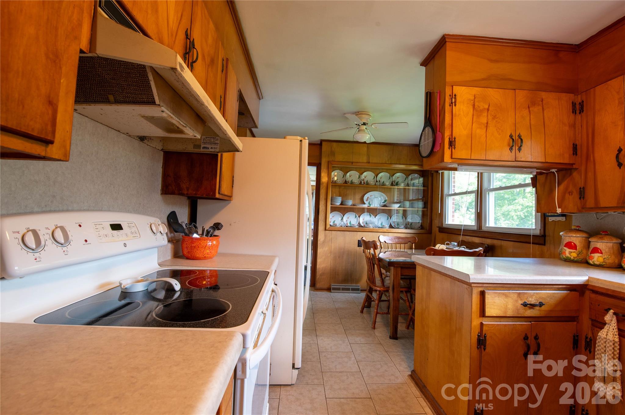 40 Double Island Road Burnsville, NC 28714 - Photo 17 of 38 a kitchen with a sink a stove and a refrigerator