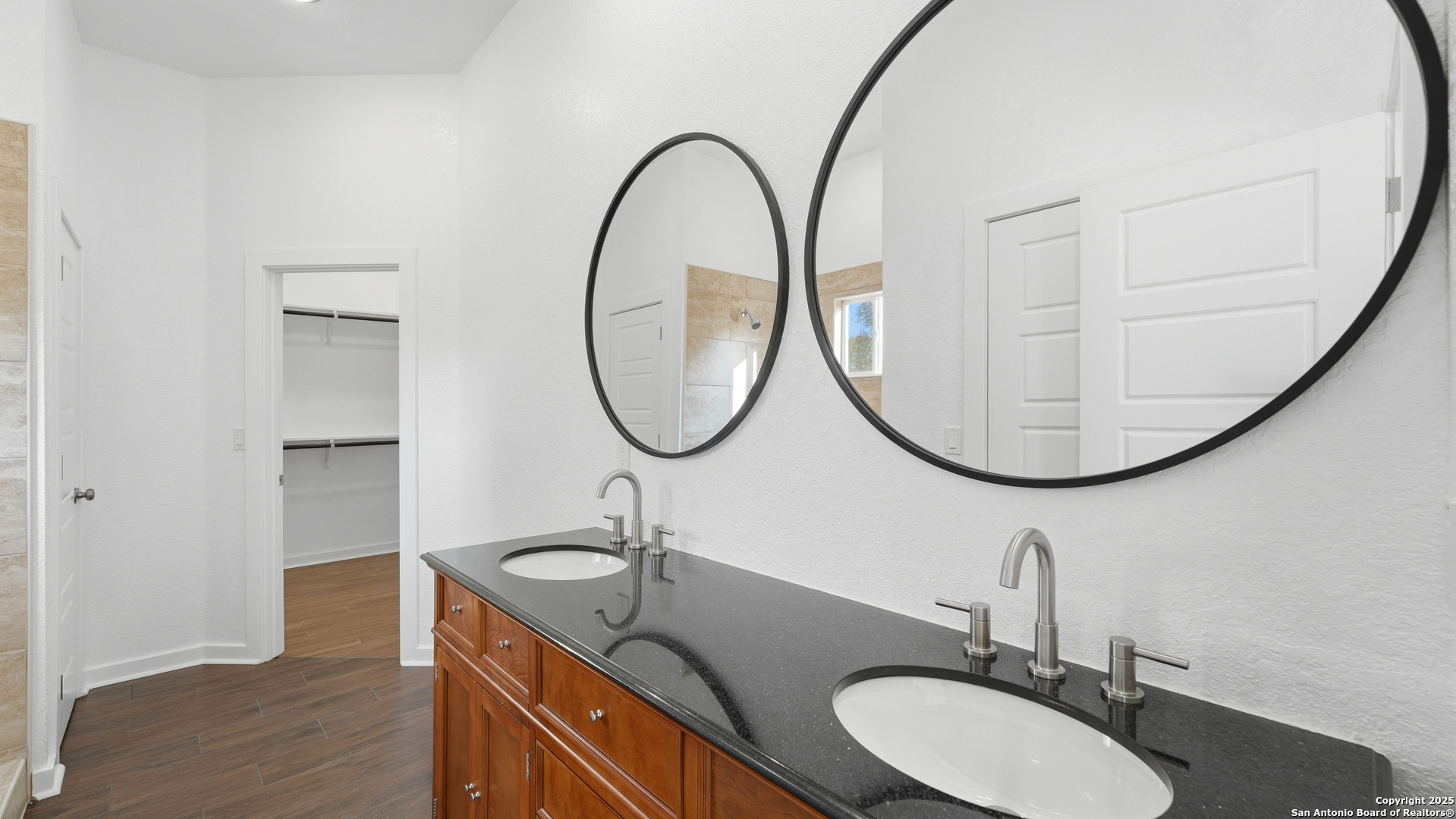 4606 Lee Way Elmendorf, TX 78112 - Photo 25 of 45 a bathroom with a sink and a mirror