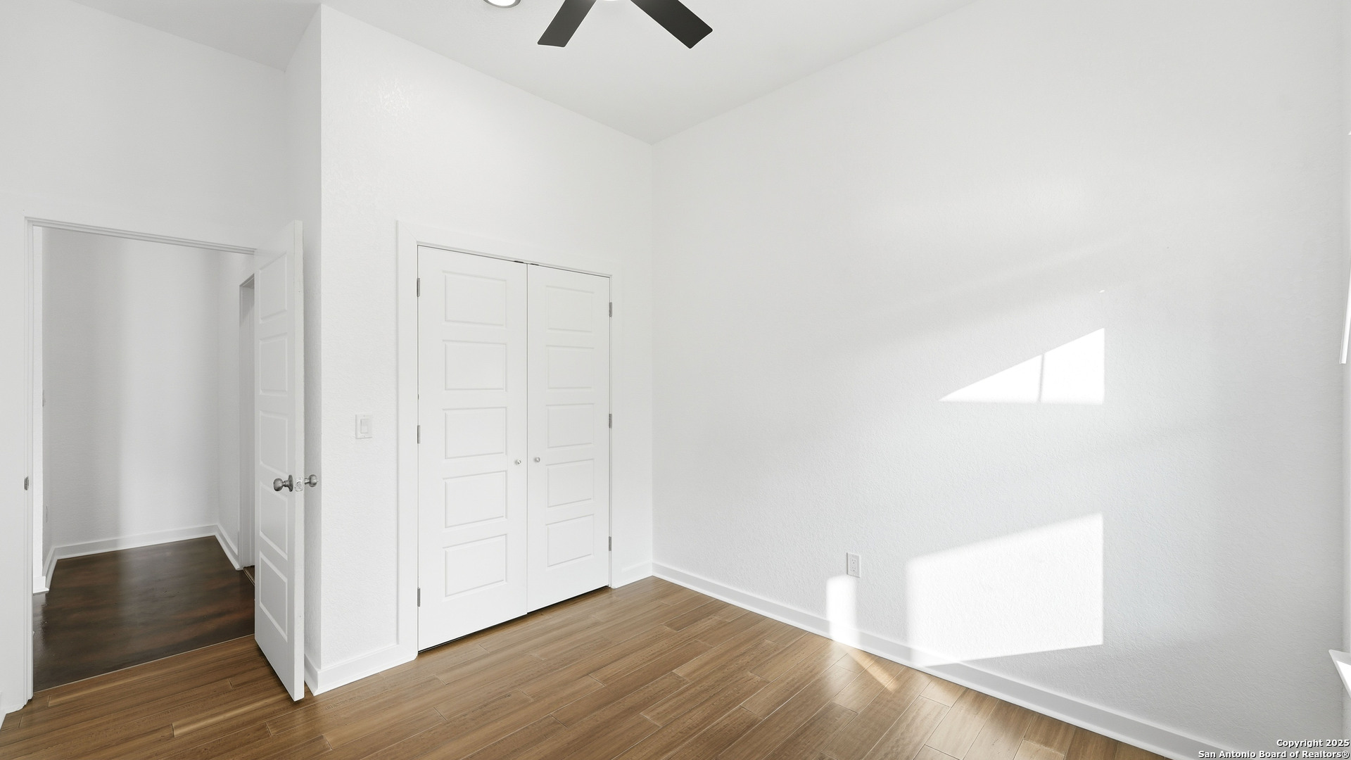 4606 Lee Way Elmendorf, TX 78112 - Photo 28 of 45 a view of an empty room with wooden floor