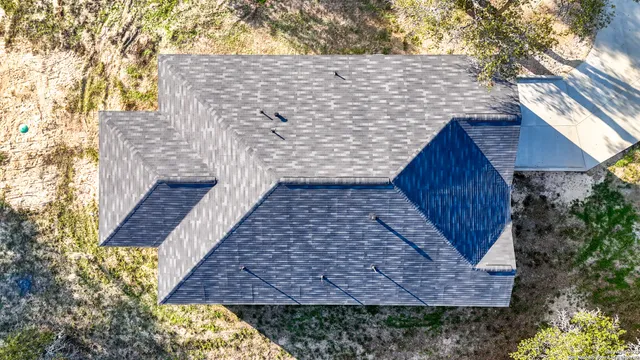 an aerial view of residential house with outdoor space