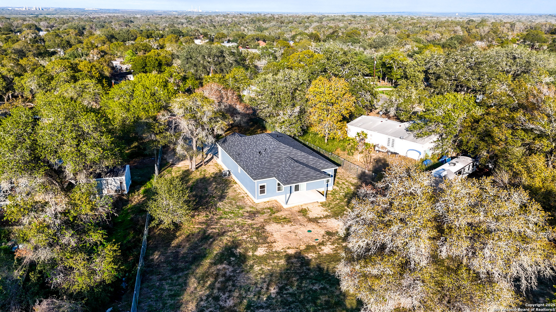 4606 Lee Way Elmendorf, TX 78112 - Photo 42 of 45 an aerial view of residential house with parking space