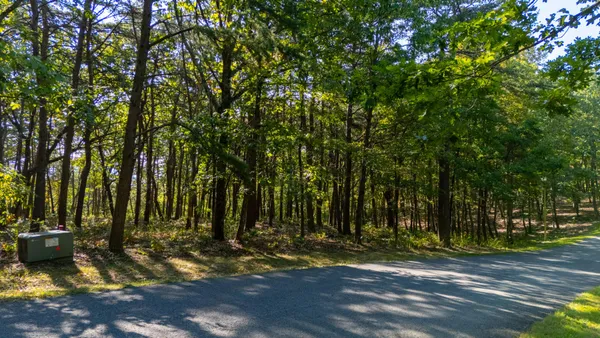 an aerial view of a house with mountain view