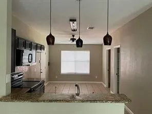 a view of a living room and kitchen