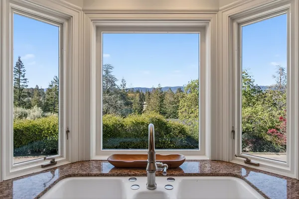 a view of a room with a window and front door