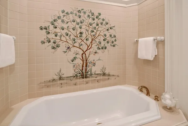 a bathroom with a bathtub and shower