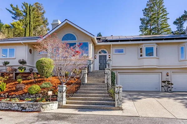 a front view of a house with garden