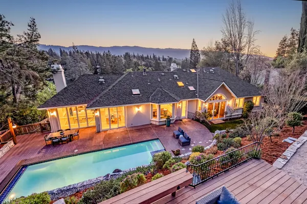 a view of a swimming pool and a yard