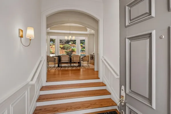 a view of a living room and entry way