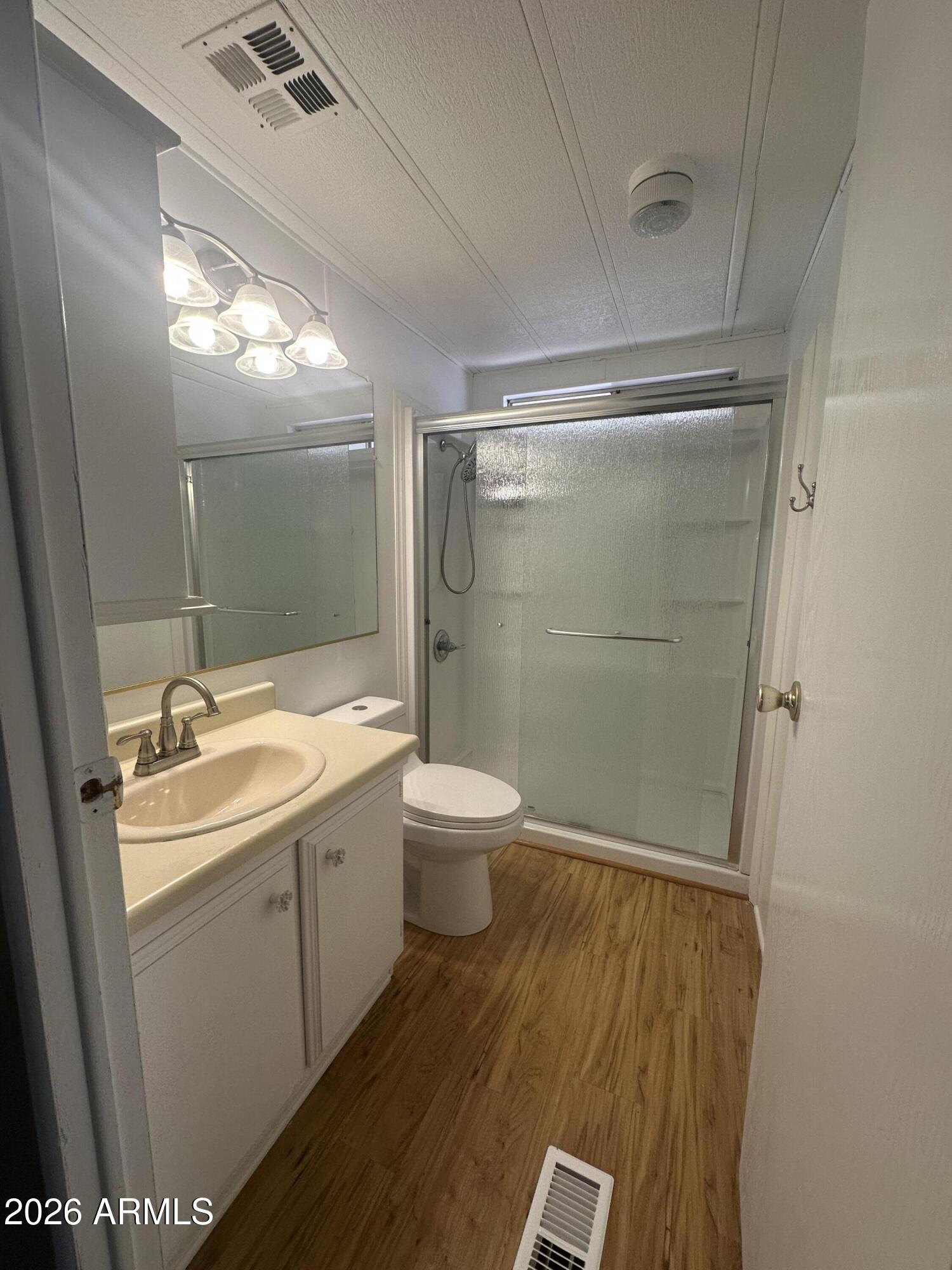 205 Sunset Drive, Unit 108 Sedona, AZ 86336 - Photo 14 of 16 a bathroom with a sink a toilet and shower