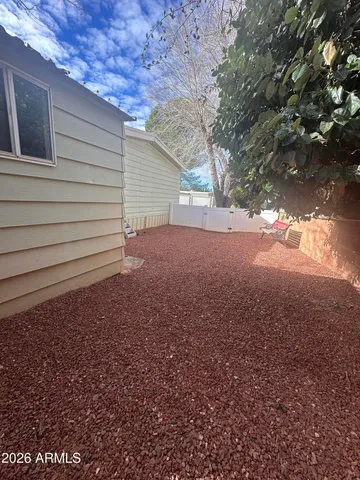 a view of a house with a yard and garage