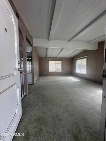 a view of empty room with windows