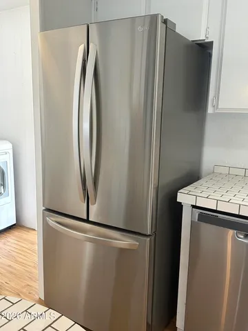a view of a refrigerator in kitchen