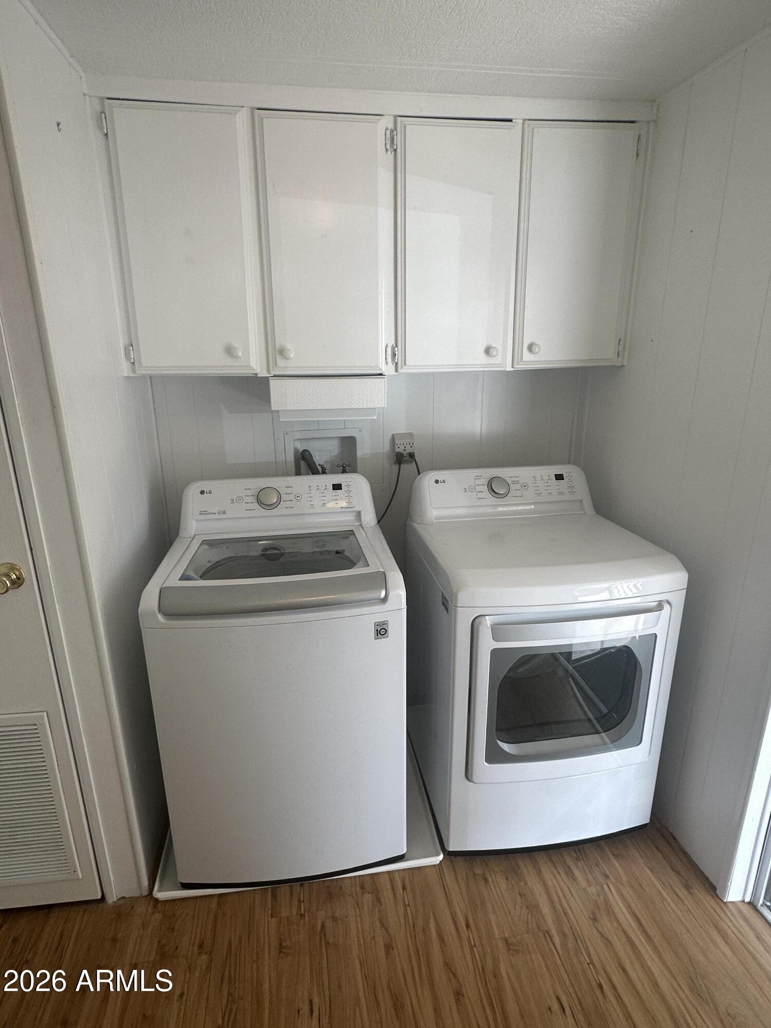 205 Sunset Drive, Unit 108 Sedona, AZ 86336 - Photo 10 of 16 a utility room with wooden floor washer and dryer